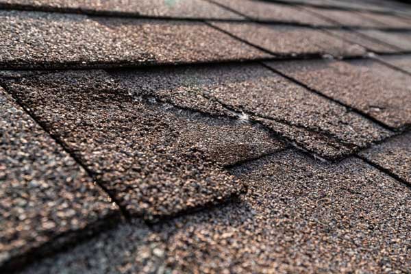ripped roof shingle repair in oklahoma